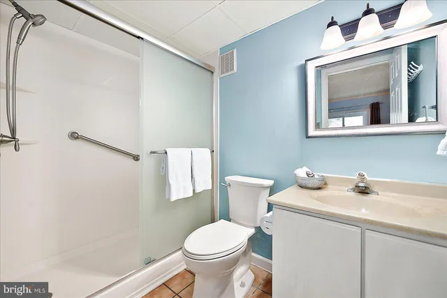 a bedroom with a bed and cabinets