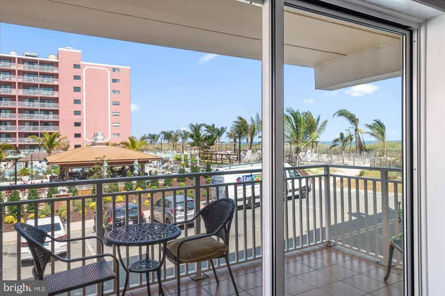 a view of a balcony with chairs