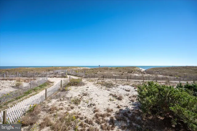 a tall building with a window and balcony