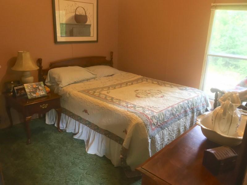 213 Midkiff Road Southeast Floyd, VA 24091 - Photo 17 of 20 a bedroom with a bed and a window