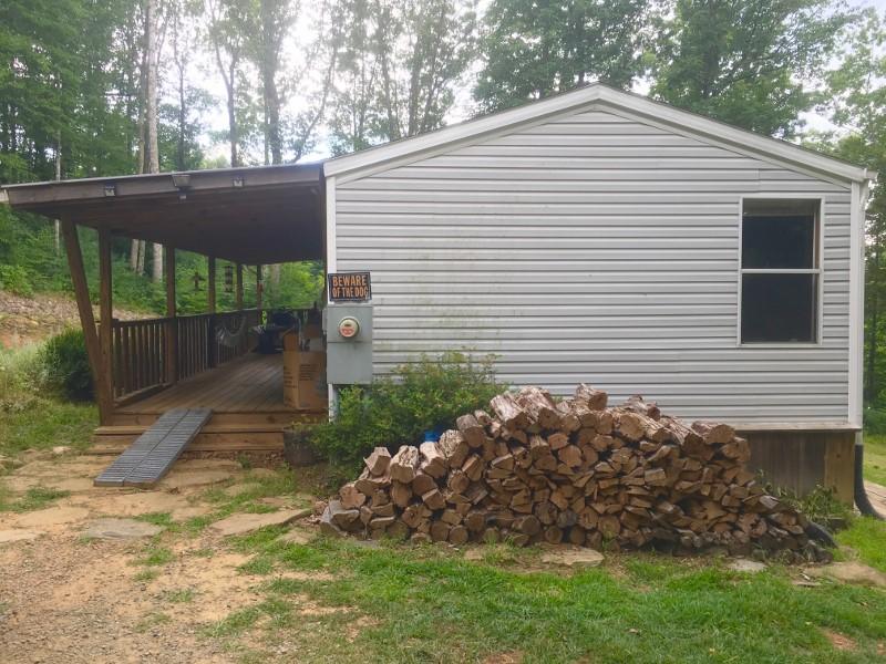 213 Midkiff Road Southeast Floyd, VA 24091 - Photo 3 of 20 a front view of a house with garden