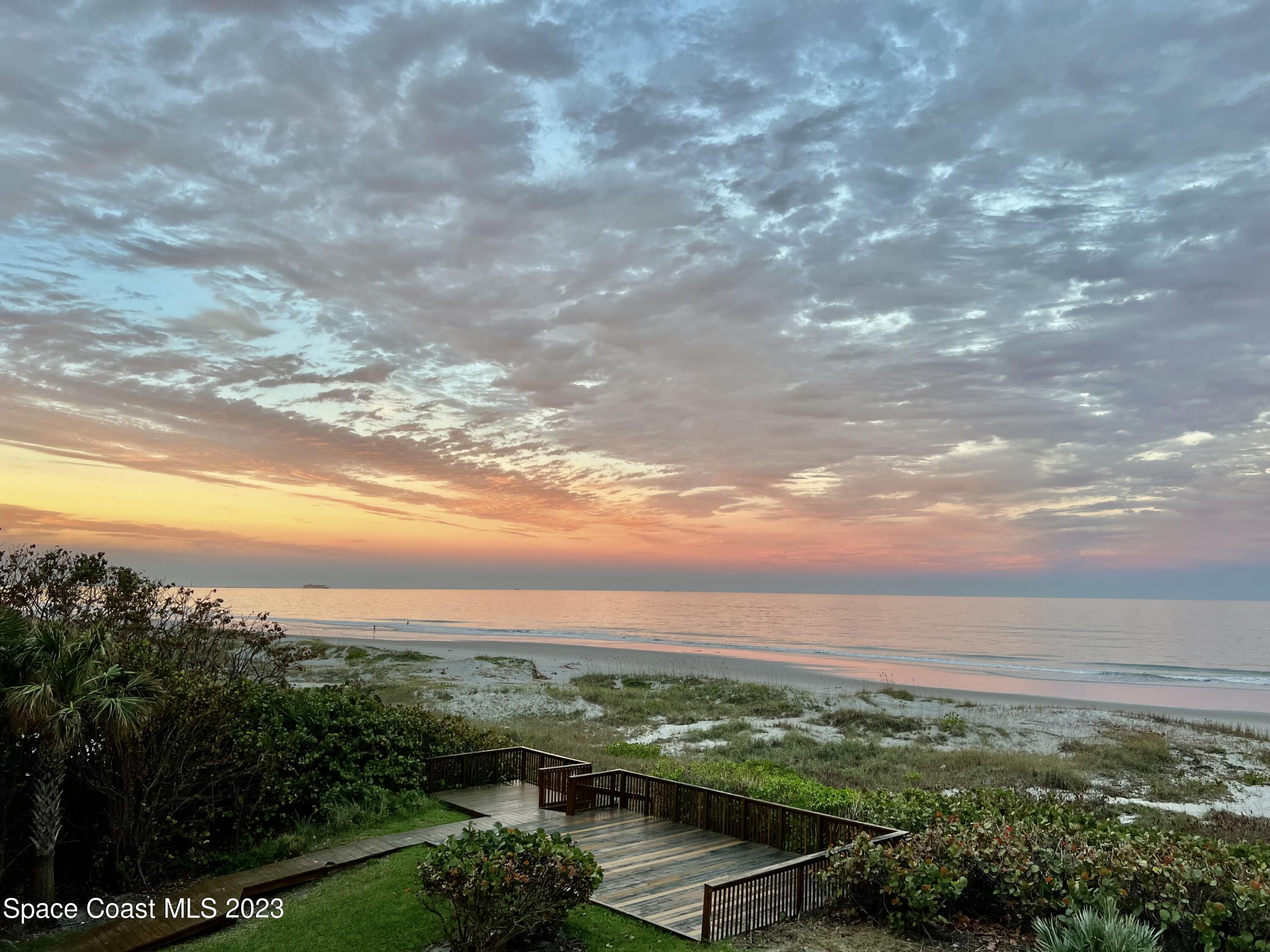 2375 South Atlantic Avenue, Unit 302 Cocoa Beach, FL 32931 - Photo 28 of 36 a view of a city with lush green forest