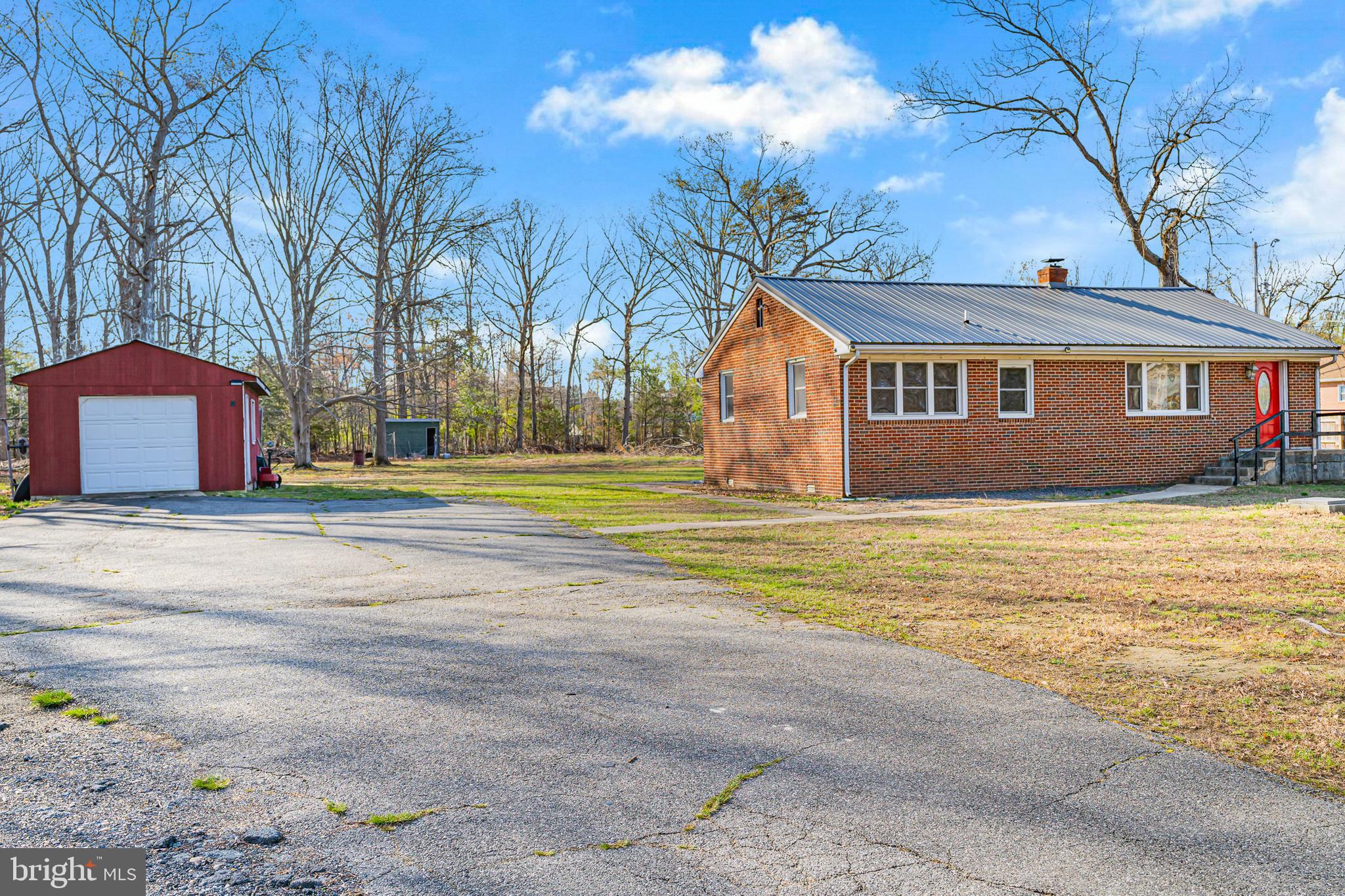 6156 Ripley Road La Plata, MD 20646 - Photo 2 of 26 a front view of house with yard and trees around