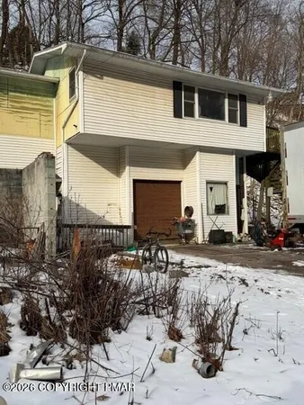 a view of a backyard of the house