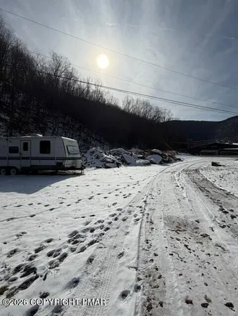 a view of a street with cars