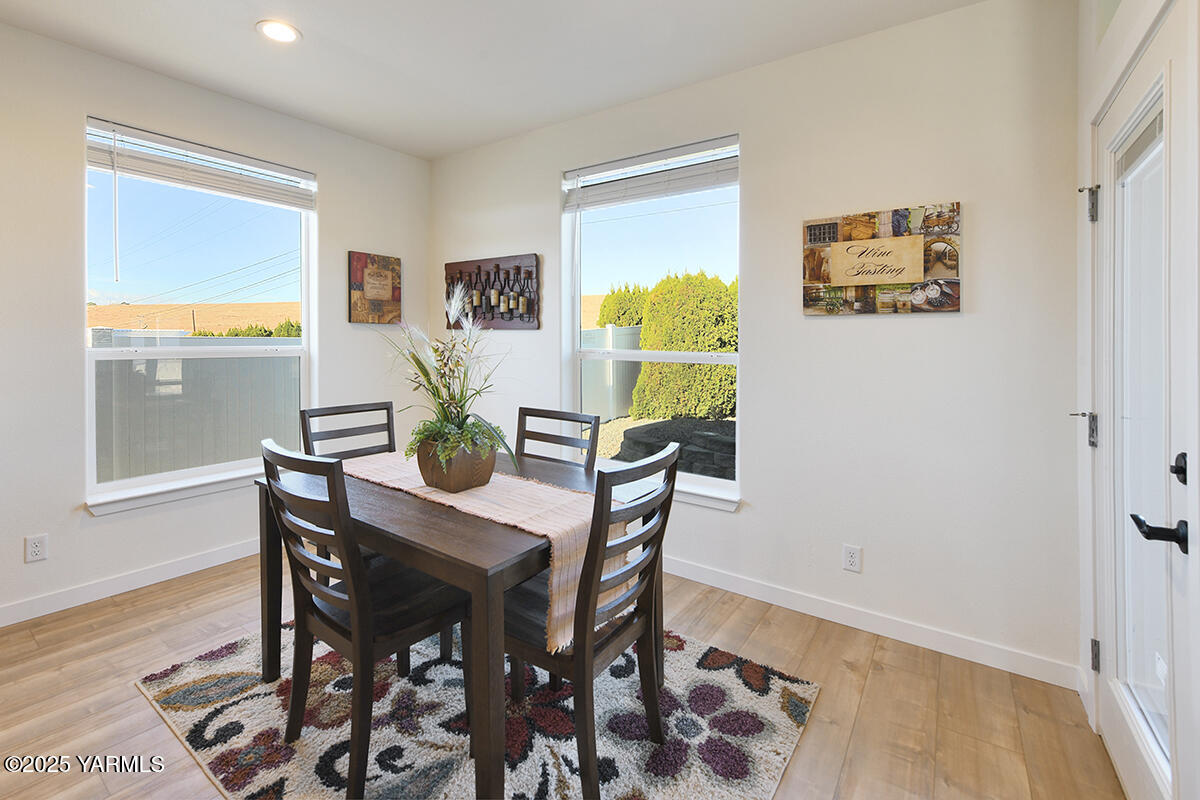 200 Bridle Way, Unit 129 Yakima, WA 98901 - Photo 12 of 20 a dining room with furniture and wooden floor