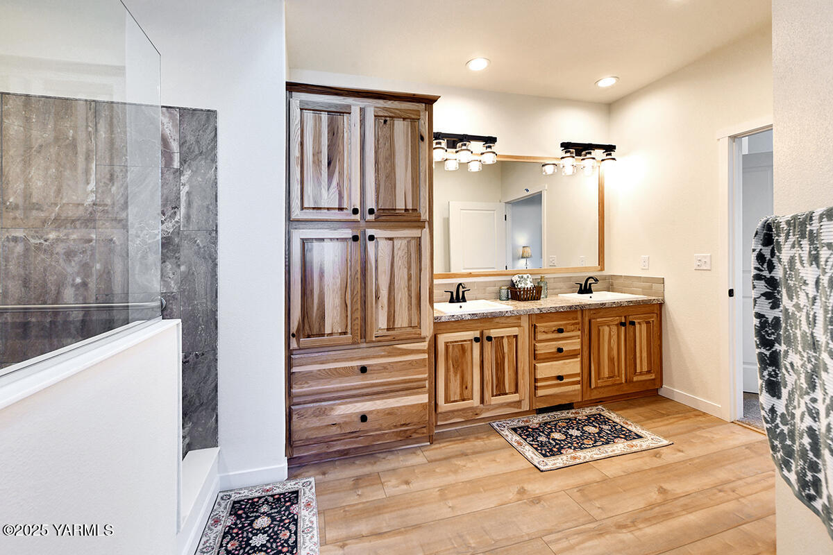 200 Bridle Way, Unit 129 Yakima, WA 98901 - Photo 19 of 20 a kitchen with stainless steel appliances kitchen island granite countertop a refrigerator and a stove top oven