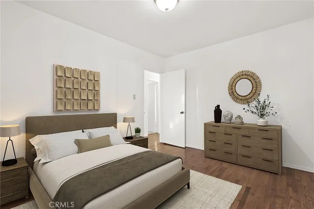 a bedroom with a bed and a dresser