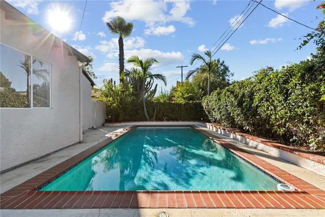 a view of swimming pool with a patio