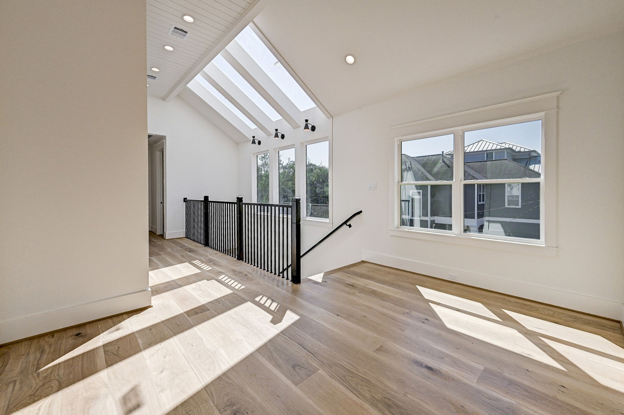 1520 Nicholson Street Houston, TX 77008 - Photo 13 of 34 a view of an empty room with wooden floor and a window