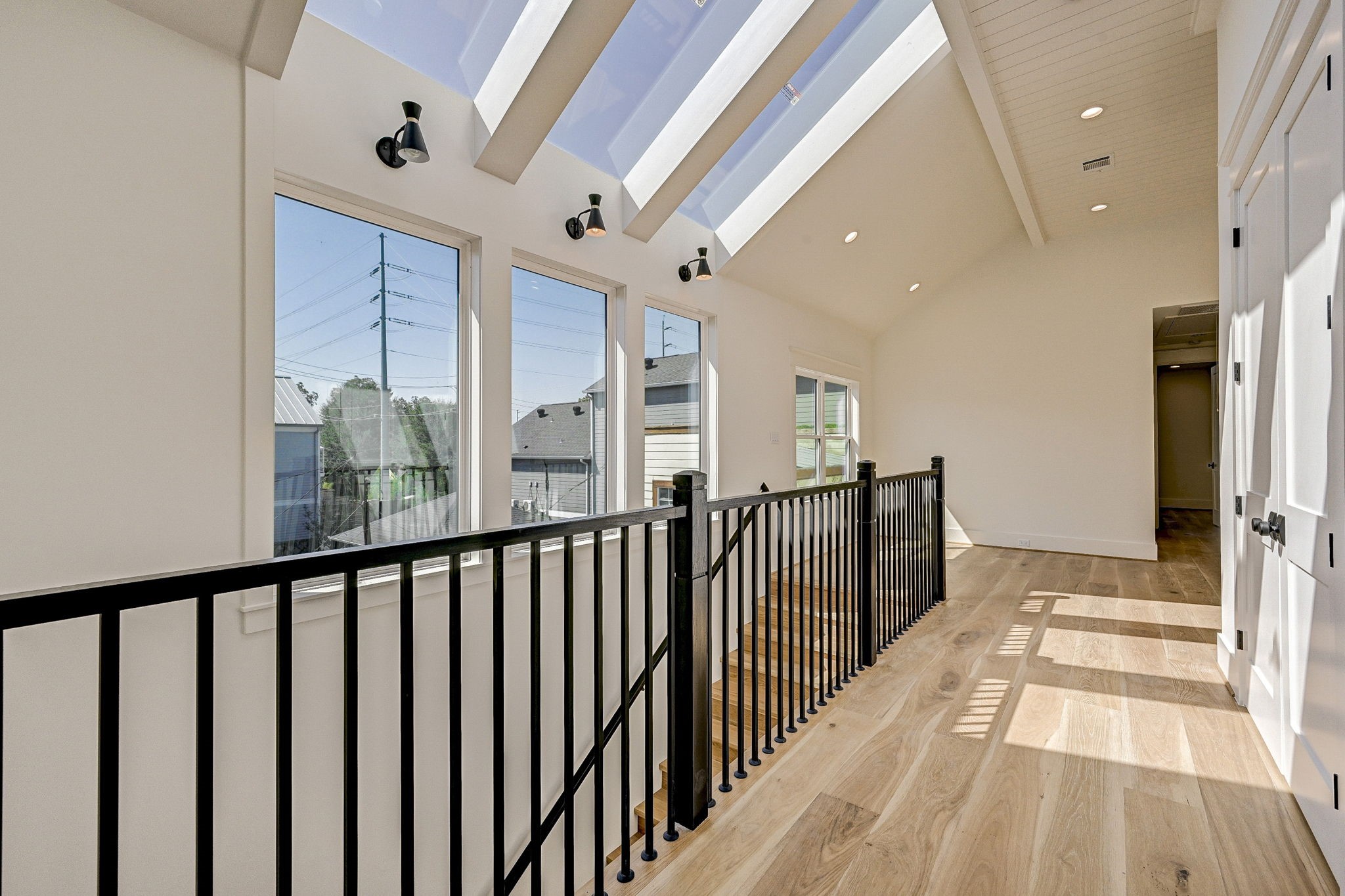 1520 Nicholson Street Houston, TX 77008 - Photo 14 of 34 a view of a hallway with wooden floor and staircase