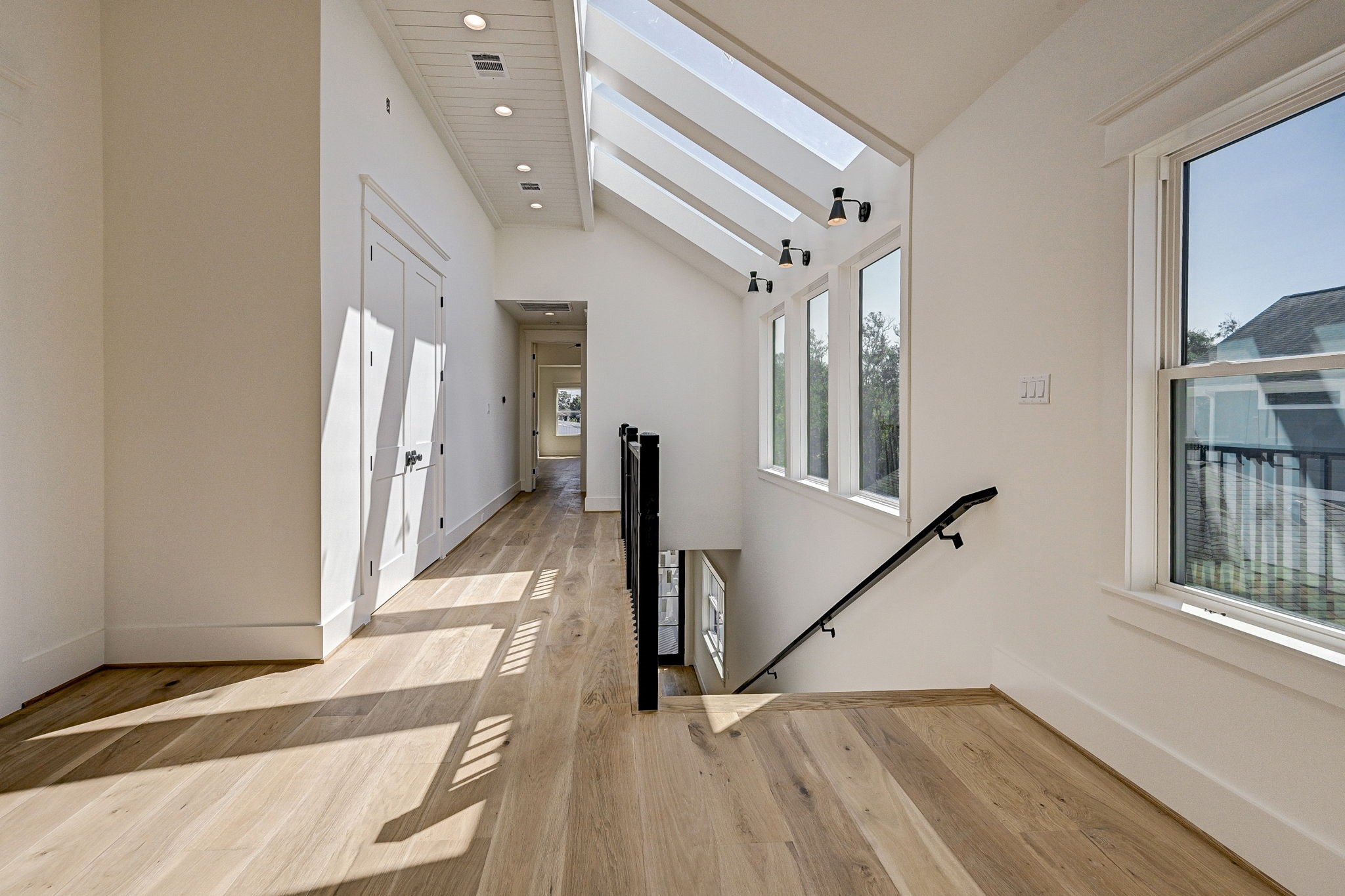 1520 Nicholson Street Houston, TX 77008 - Photo 15 of 34 a view of hallway with stairs and wooden floor
