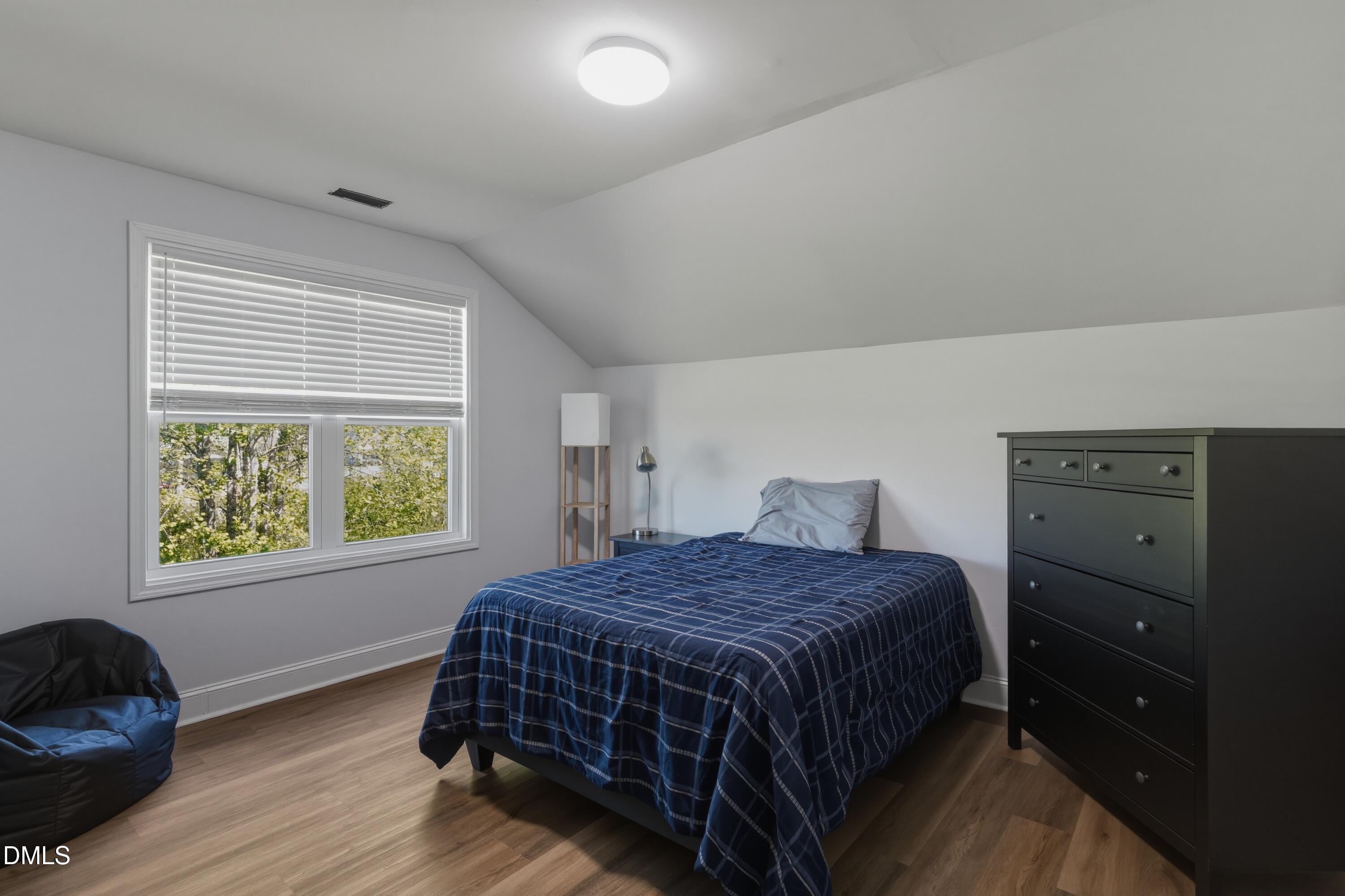 386 Howards Crossing Drive Wendell, NC 27591 - Photo 19 of 31 a bedroom with a bed and window