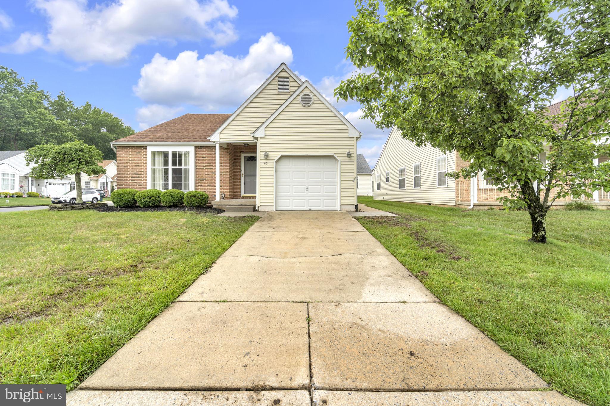 801 Freeport Way Williamstown, NJ 08094 - Photo 2 of 29 a front view of a house with a yard and trees