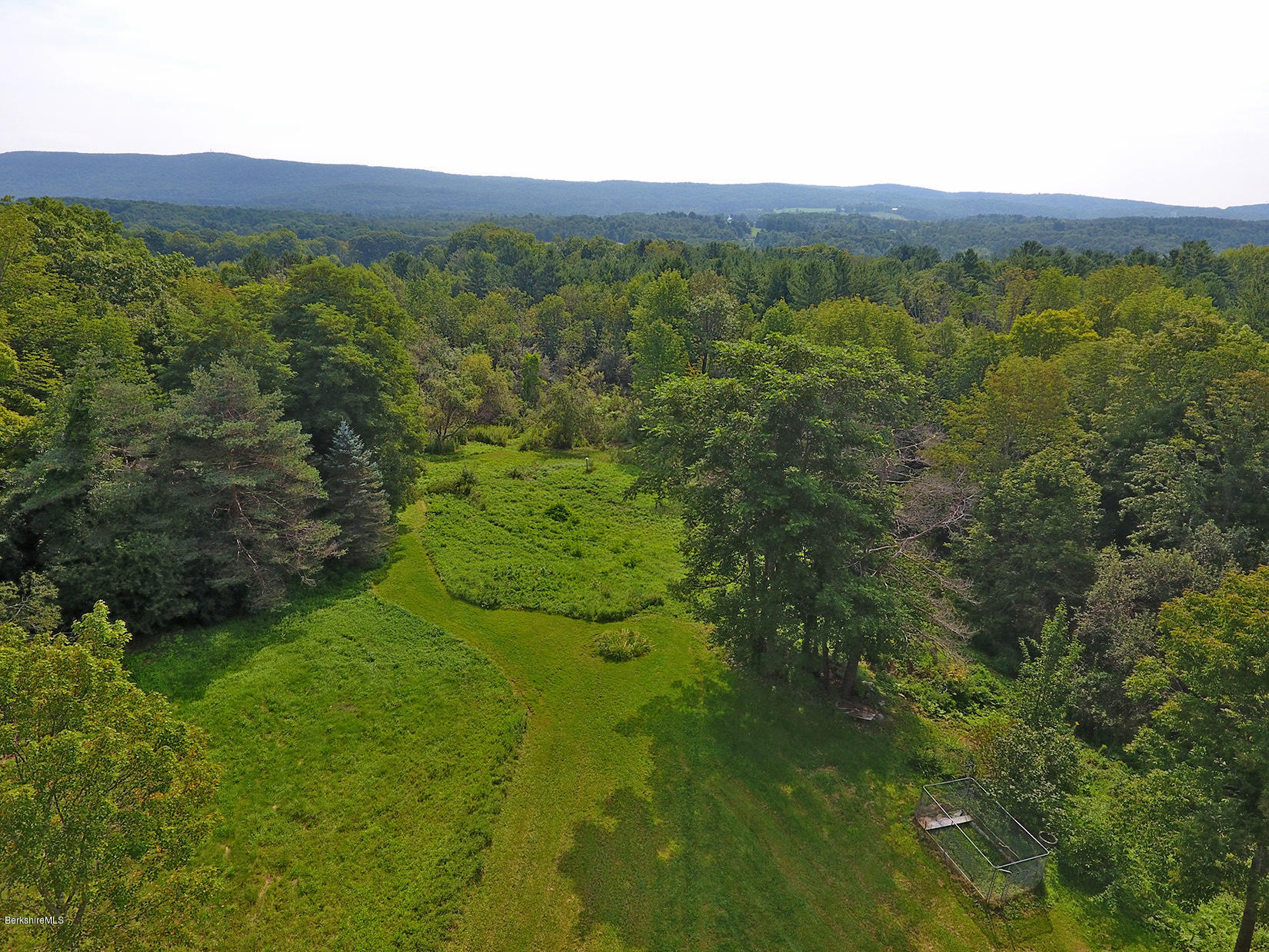 1455 State Road Richmond, MA 01254 - Photo 2 of 15 a view of a lush green outdoor space with a lake view and mountain view