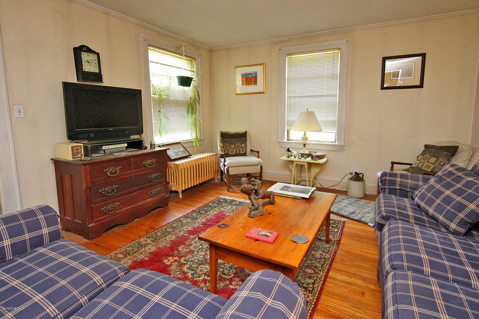 1455 State Road Richmond, MA 01254 - Photo 13 of 15 a living room with furniture and a flat screen tv