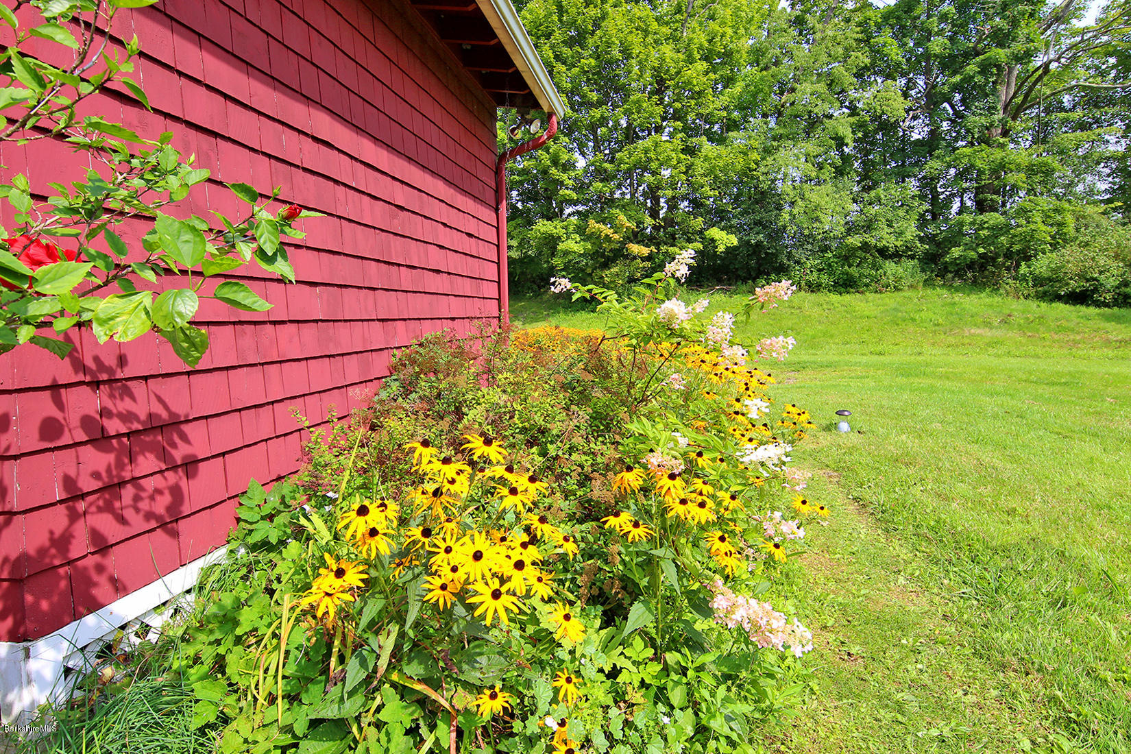 1455 State Road Richmond, MA 01254 - Photo 9 of 15 a backyard of a house with lots of green space and garden