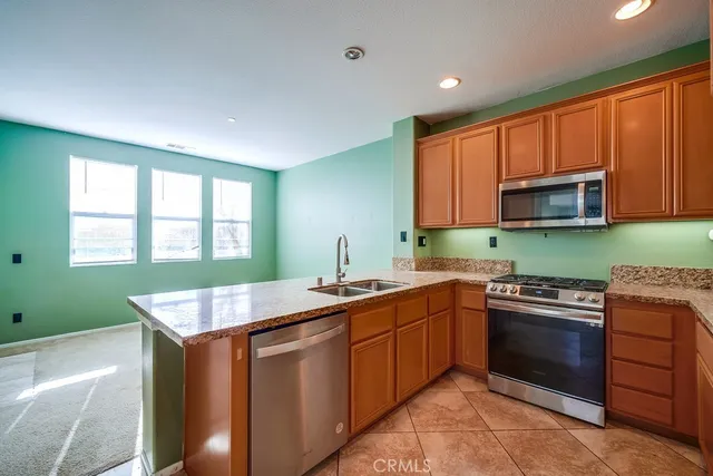 a living room with a fireplace and a window