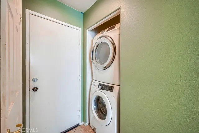 a view of hallway with a window and a livingroom
