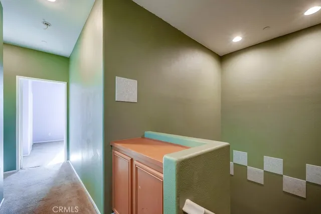 a bathroom with a bathtub sink and mirror