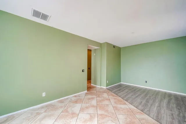 a kitchen with granite countertop stainless steel appliances a stove sink and microwave