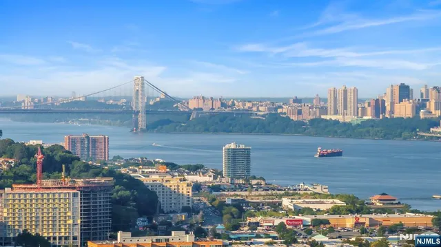 an aerial view of a houses with outdoor space and lake view