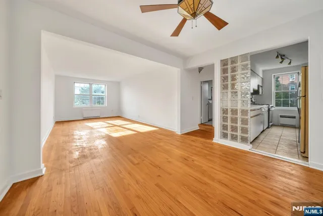a kitchen with stainless steel appliances granite countertop a refrigerator and a stove