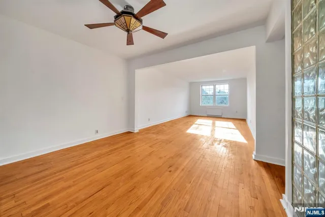 a kitchen with stainless steel appliances granite countertop a stove and a refrigerator
