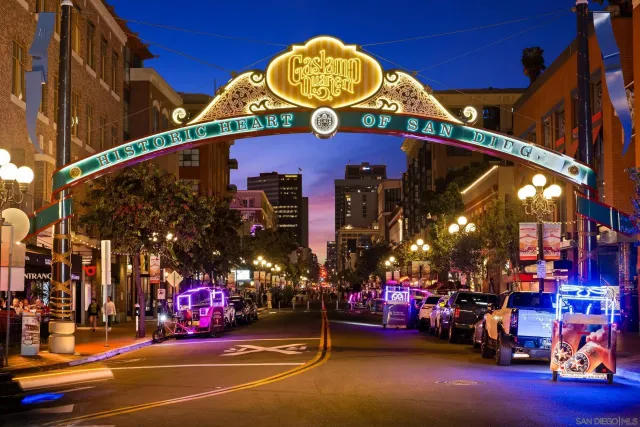a room with lots of wooden furniture and windows