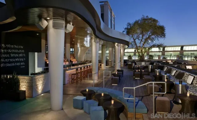 a outdoor living space with patio furniture and a potted plant