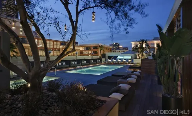 a living room with furniture and chandelier