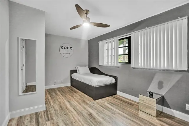 a bedroom with a bed and a couch