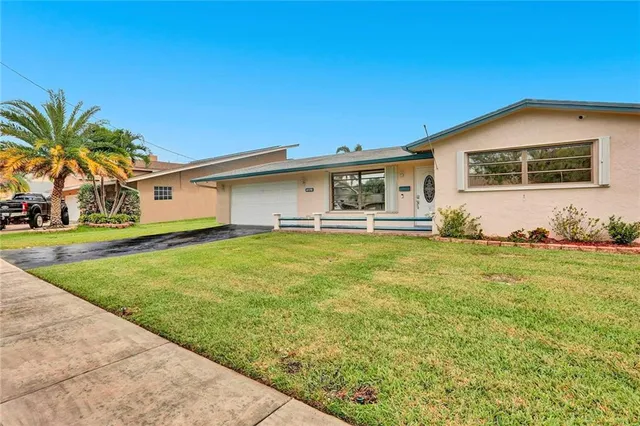 a front view of house with yard