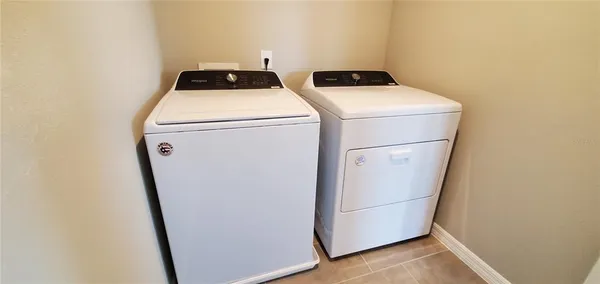 a utility room with dryer and washer
