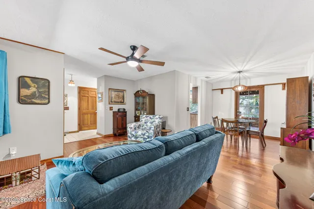 a living room with furniture rug and window