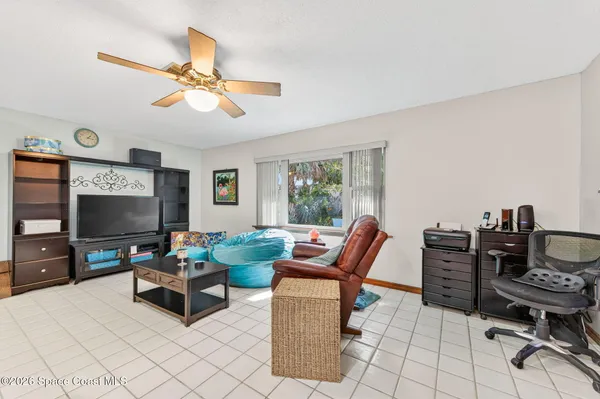 a living room with furniture fireplace and a flat screen tv
