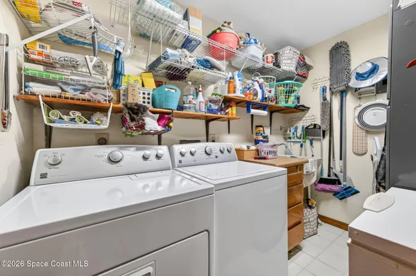 a living room with patio furniture and a floor to ceiling window