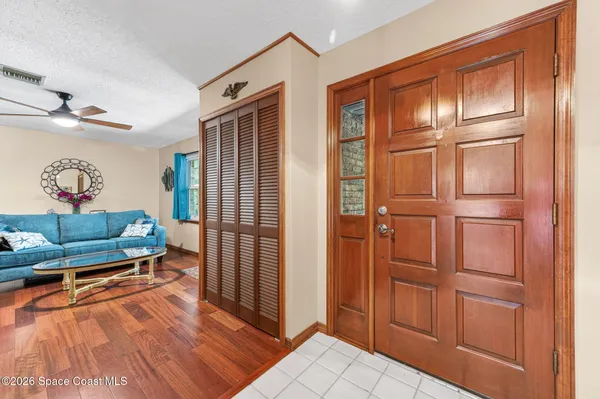 a view of a livingroom with furniture and wooden floor