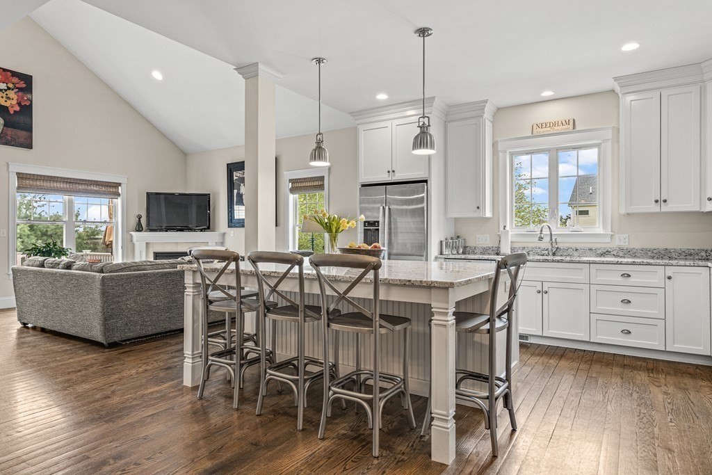 341 Hunnewell Street, Unit 341 Needham, MA 02494 - Photo 1 of 39 a view of kitchen with stainless steel appliances granite countertop a stove a sink a dining table and chairs