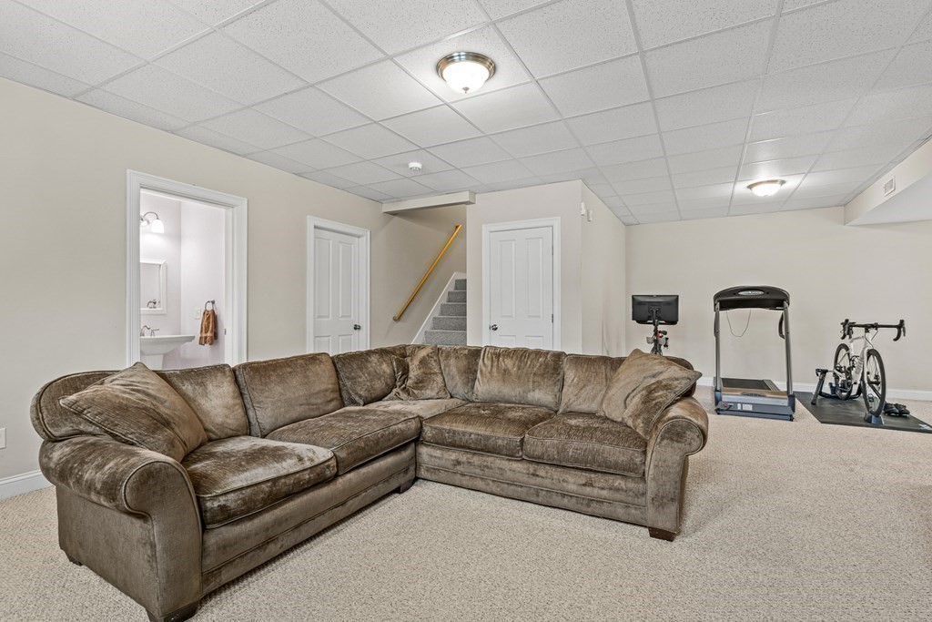 341 Hunnewell Street, Unit 341 Needham, MA 02494 - Photo 28 of 39 a living room with furniture and a couch