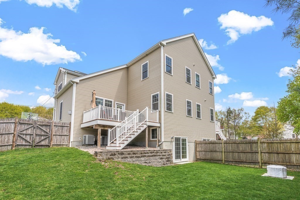 341 Hunnewell Street, Unit 341 Needham, MA 02494 - Photo 35 of 39 a view of house with a yard