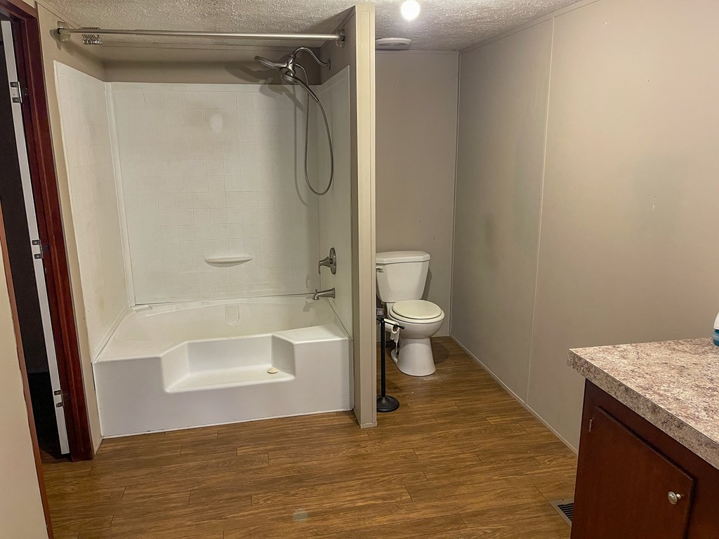 89 Kanati Trail Murphy, NC 28906 - Photo 17 of 30 a bathroom with a granite countertop bathtub shower sink and toilet