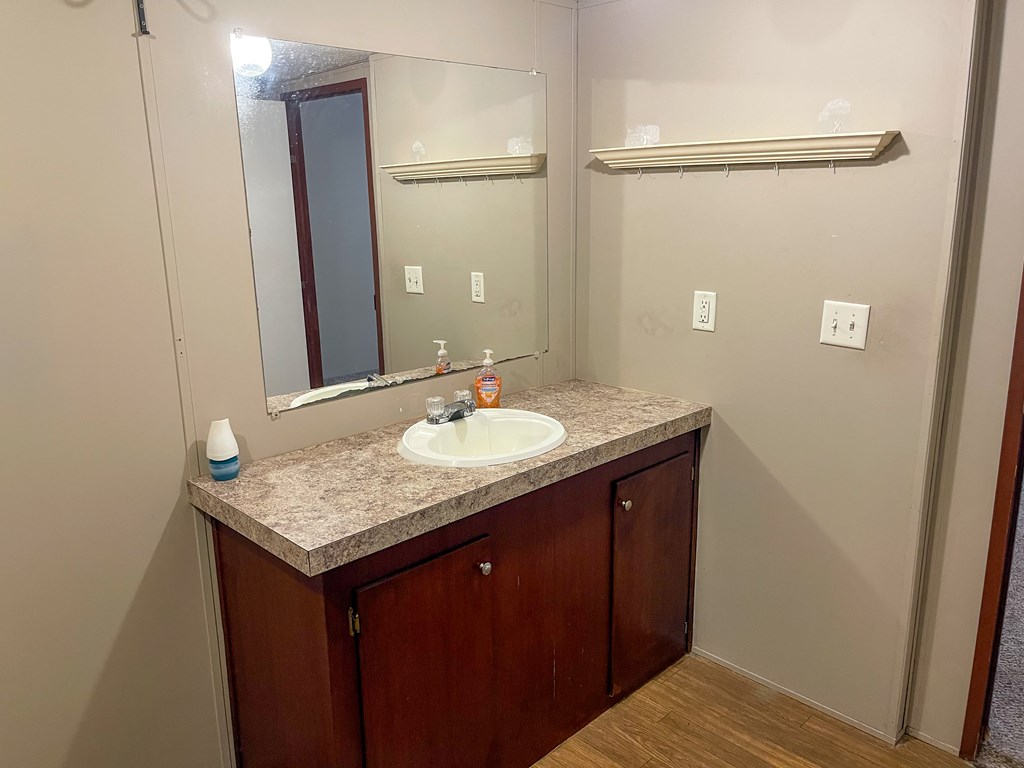 89 Kanati Trail Murphy, NC 28906 - Photo 19 of 30 a bathroom with a granite countertop sink and a mirror