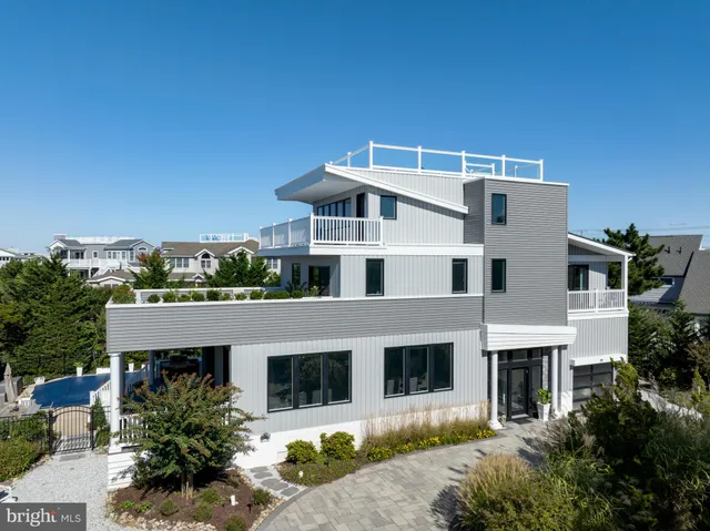 a house that has a tree in front of it