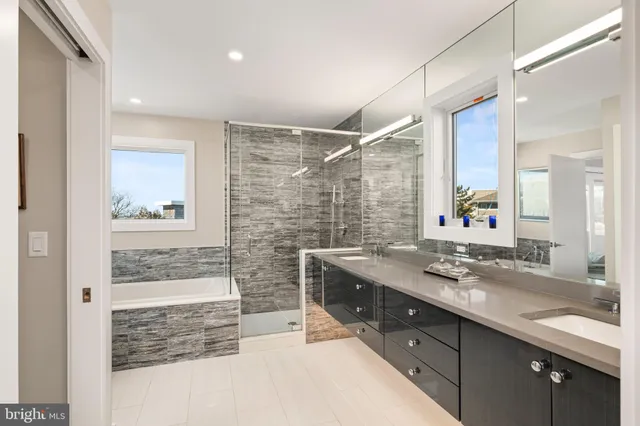 a view of a roof deck with couches and sky view
