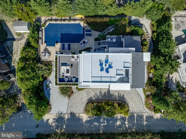 a dining room with furniture window and wooden floor