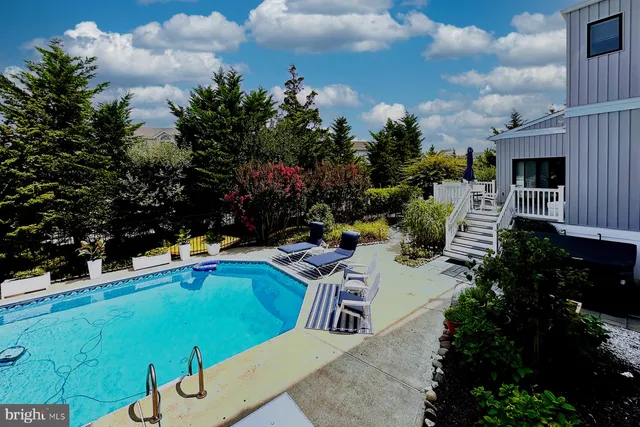 a large kitchen with a table and chairs