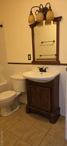 a bathroom with a toilet and a sink