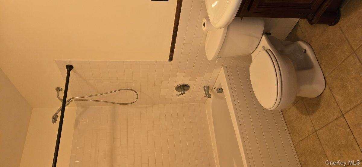 235 West 137th Street, Unit 1F Manhattan, NY 10030 - Photo 12 of 27 a bathroom with a toilet a sink and a shower