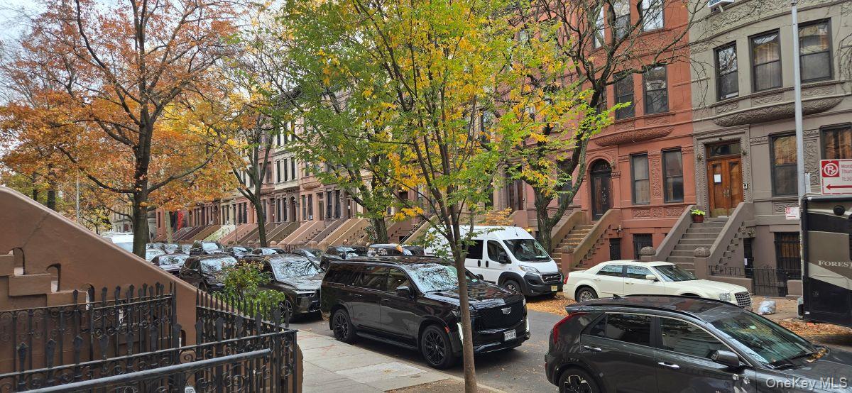 235 West 137th Street, Unit 1F Manhattan, NY 10030 - Photo 22 of 27 a view of a car park in front of a building